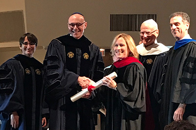 Hebrew Union College-Jewish Institute of Religion President Andrew Rehfeld, Ph.D., presents Rabbi Karen Bender with an Honorary Doctorate of Divinity