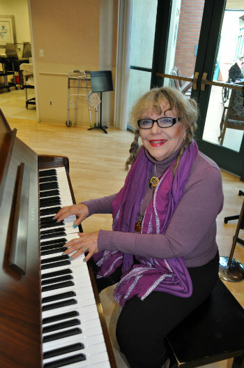 Old woman playing piano