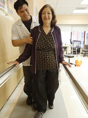 Elderly woman on walking therapy