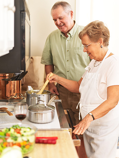 Elderly couple cooking