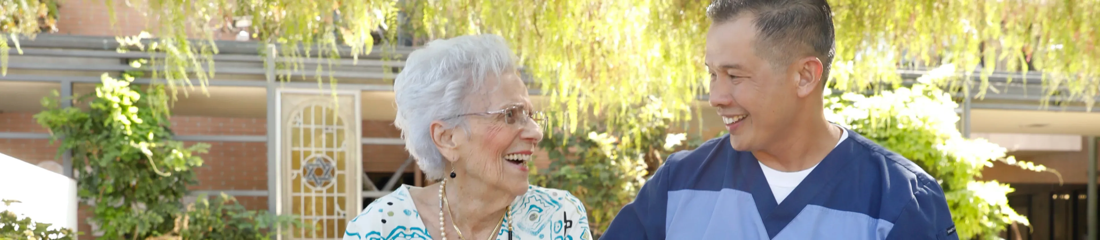 Woman and caregiver smiling