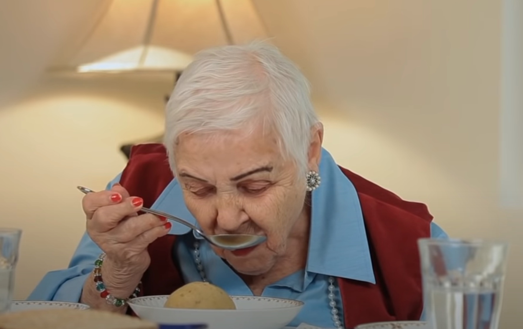 Woman eating Matzo ball soup