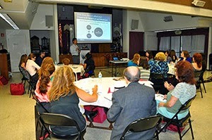 Group of people listening to the presentation